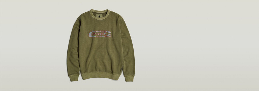pull délavé avec logo g déchiré