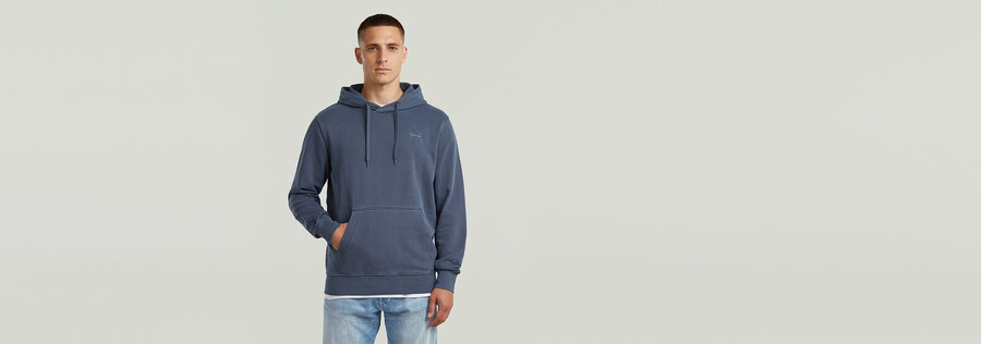 sweat à capuche teint avec logo