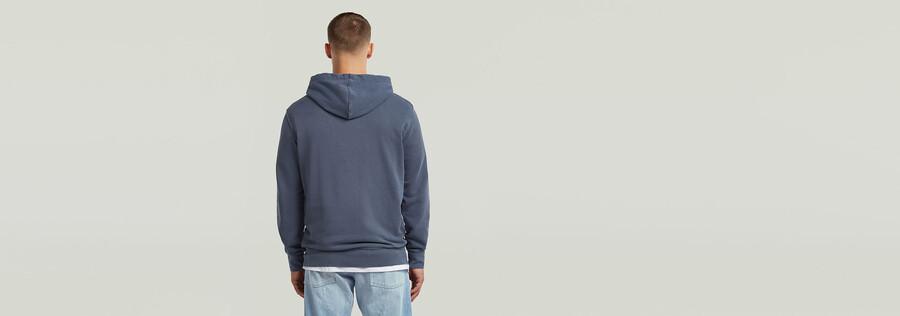 sweat à capuche teint avec logo