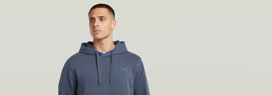sweat à capuche teint avec logo